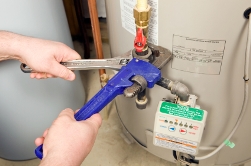 Foley Alabama Heating and Cooling tech repairing water heater